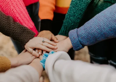 Community united together, picture of hands stack on top of each other