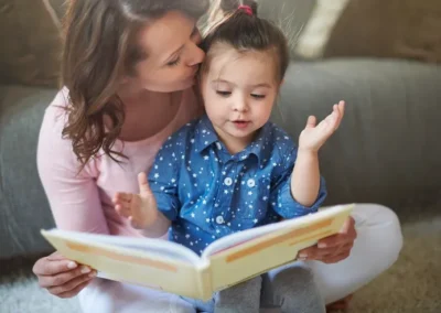 Mother reading a book with her child